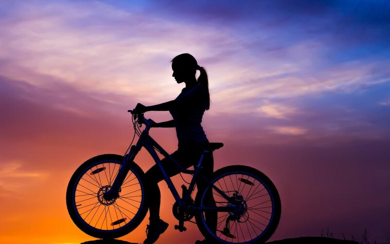 Woman on Bicycle — Purple, Dramatic
