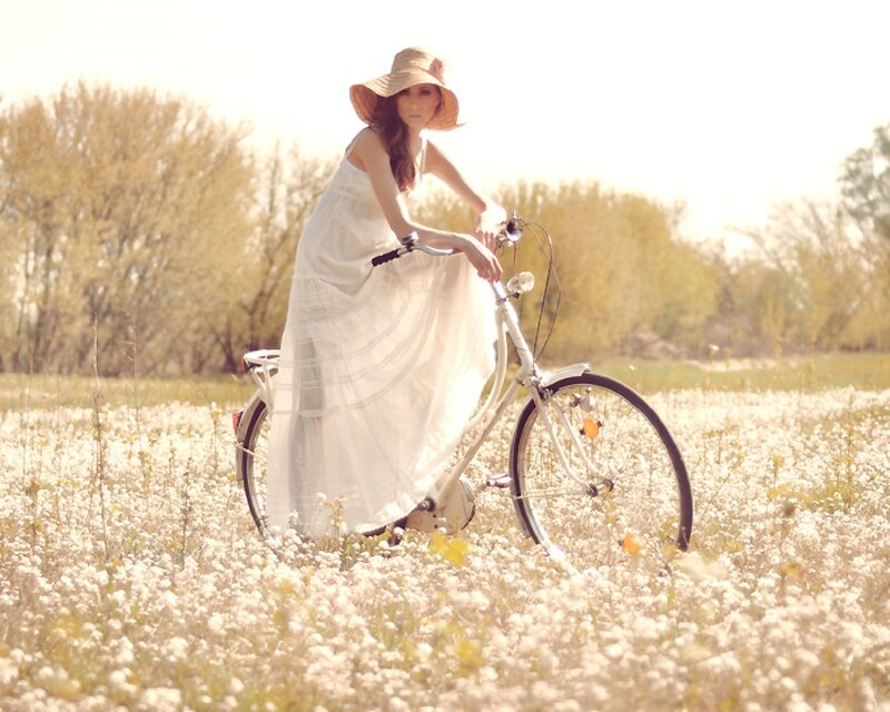 Woman on Bicycle — White, Serene