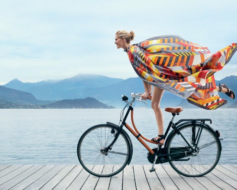 Woman on bicycle with scarf