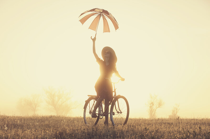 Woman on Bicycle — Yellow