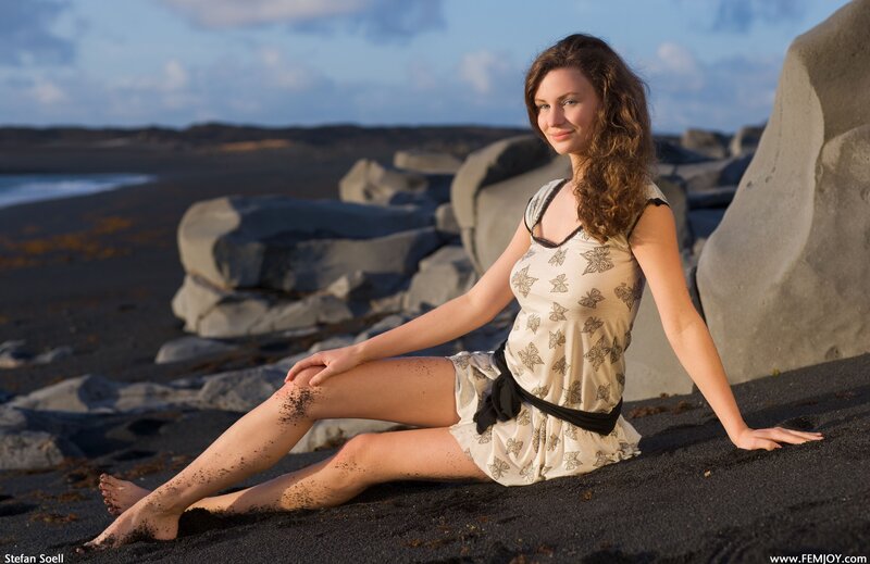 Woman on black sand beach