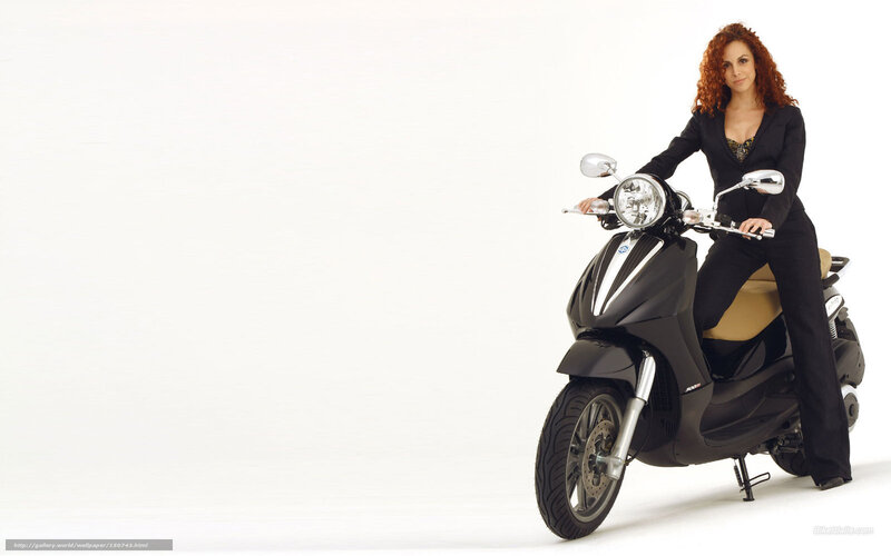 woman on black scooter