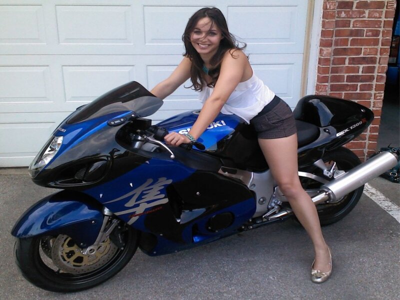 Woman on Blue Motorcycle — Happy