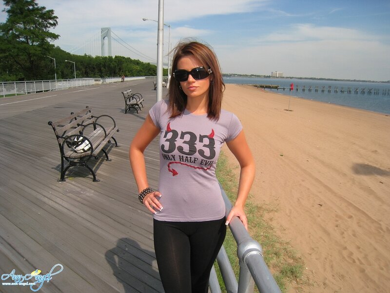 Woman on boardwalk near bridge