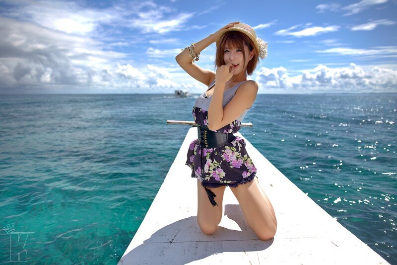 Woman on boat in tropical setting