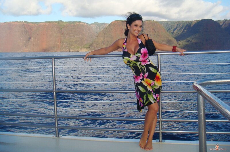 Woman on boat near cliffs