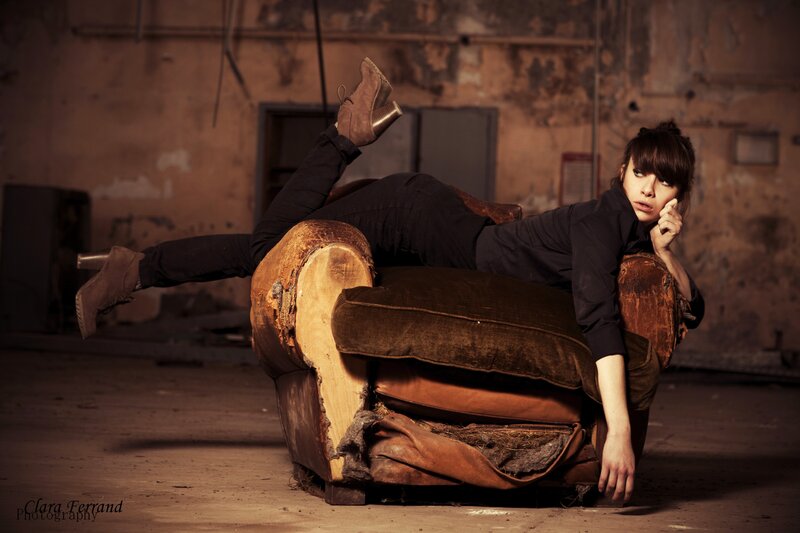 woman on broken armchair
