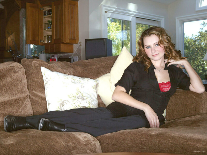 Woman on Brown Couch — Relaxed, Afternoon