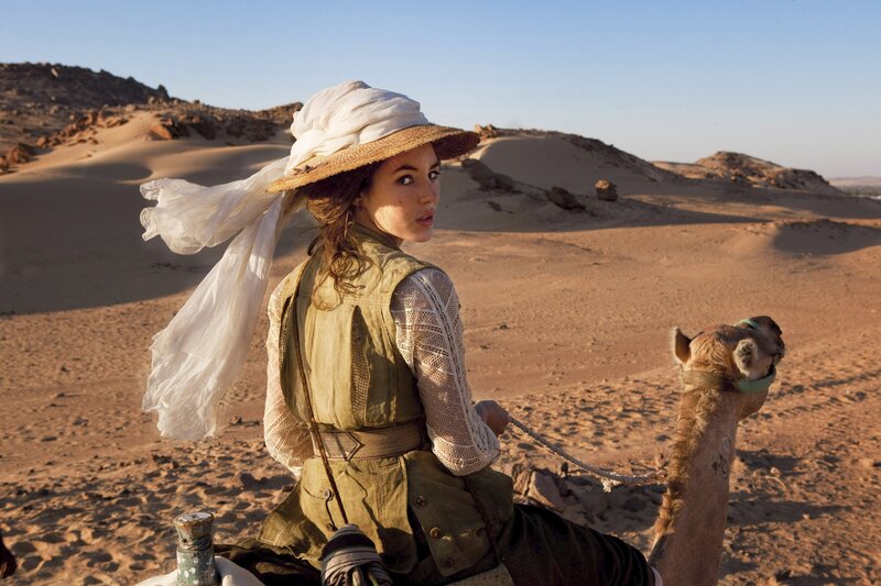 Woman on camel in desert