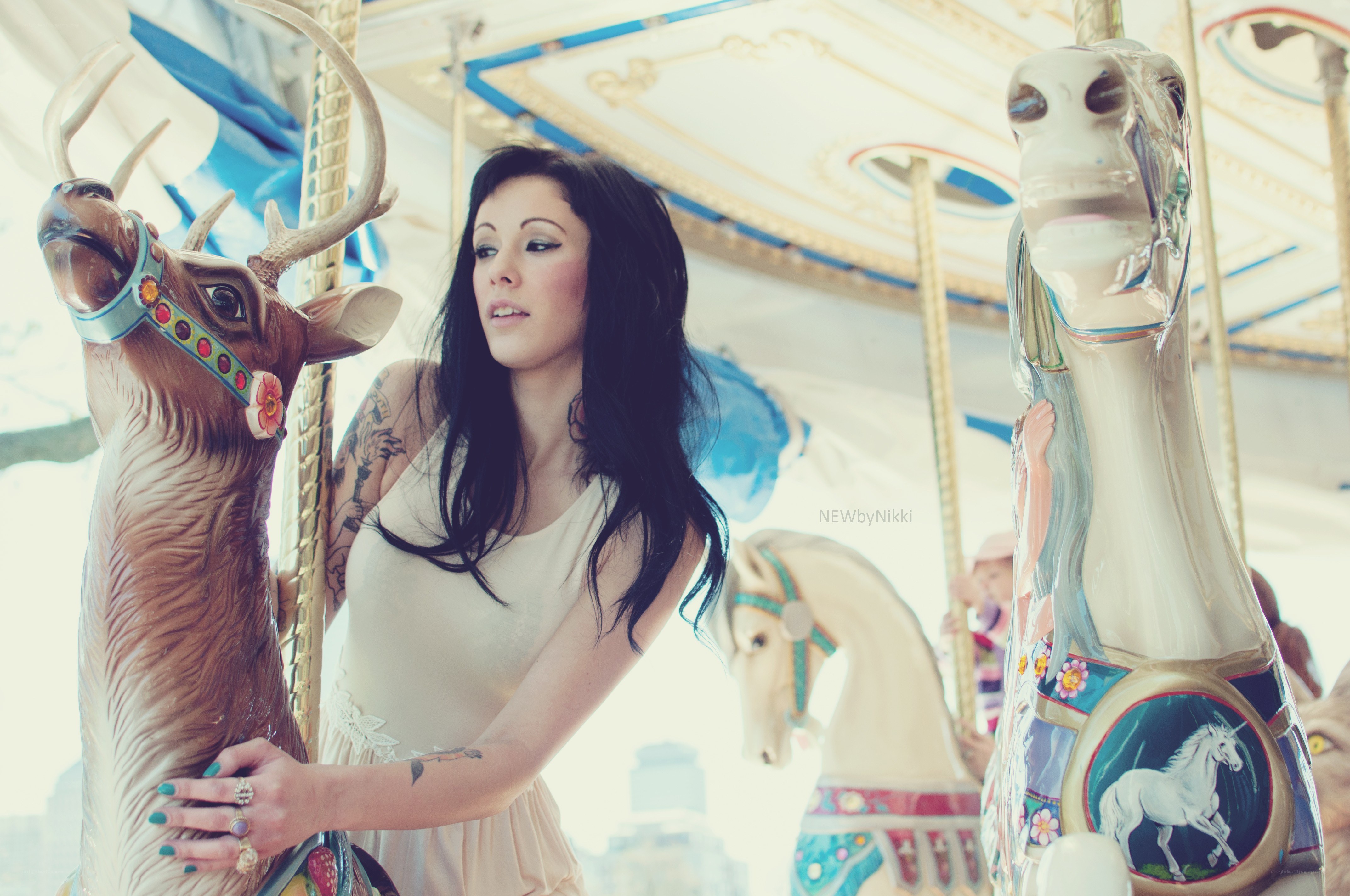 Woman on carousel with deer