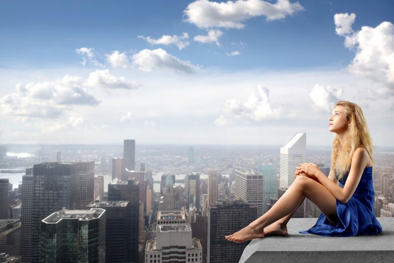 Woman on city rooftop