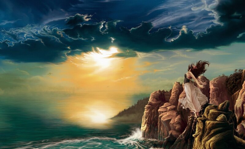woman on cliff at sunset