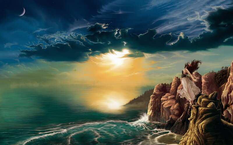 woman on cliff at sunset