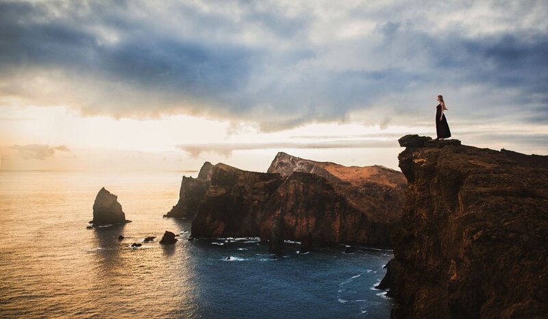 Woman on Cliff Edge — Blue, Dramatic, Sunset, Photograph