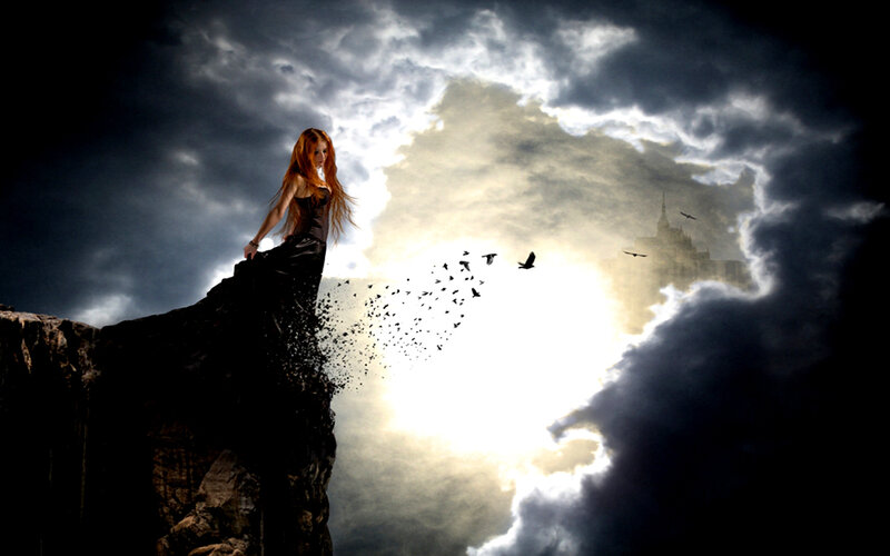 woman on cliff with birds