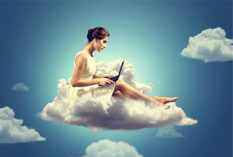 Woman on Cloud with Laptop