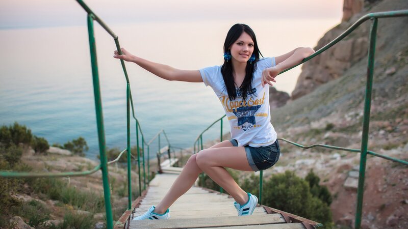 Woman on coastal stairs