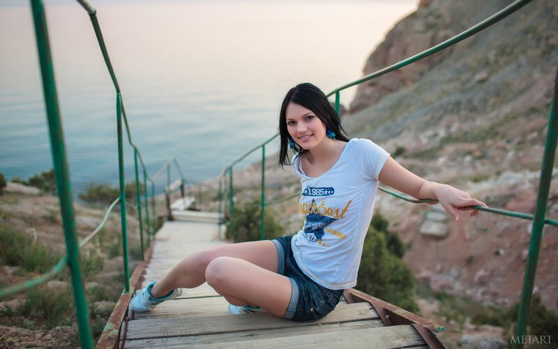 Woman on coastal stairs