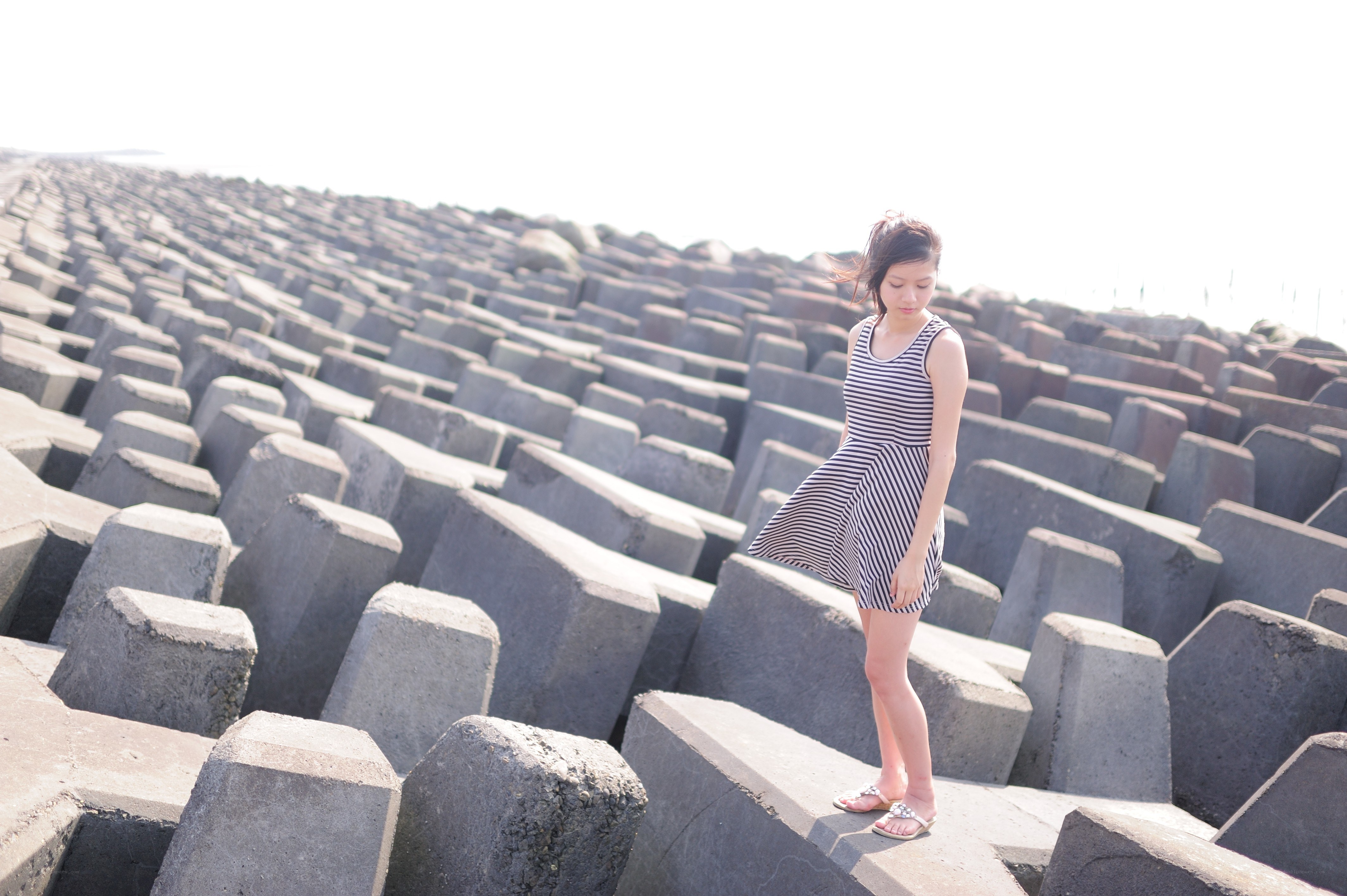 Woman on concrete blocks