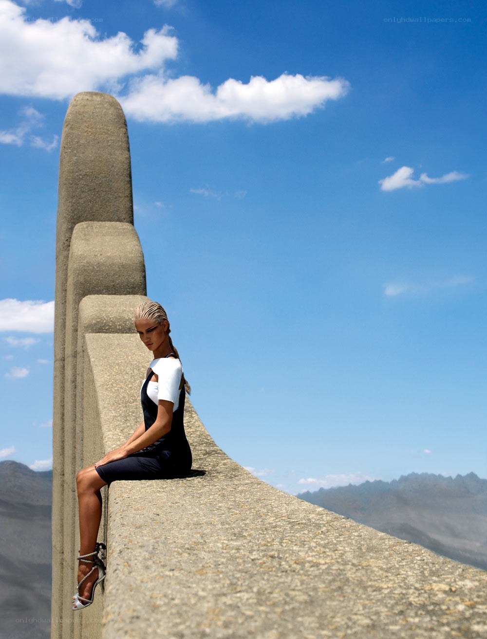 Woman on concrete structure