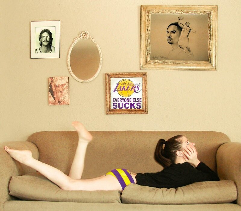 woman on couch with Lakers decor