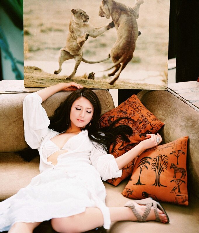 Woman on couch with lion photo