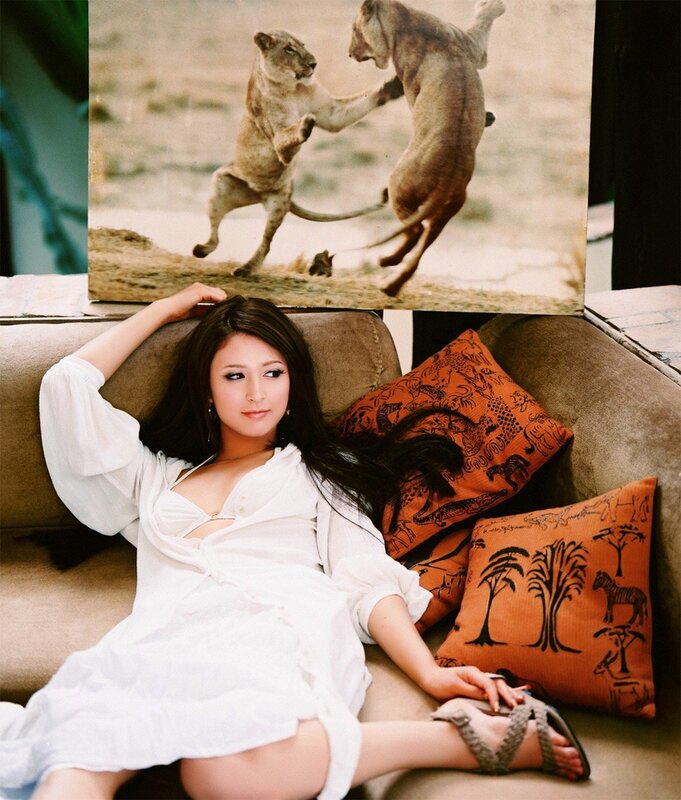 Woman on couch with lion photo