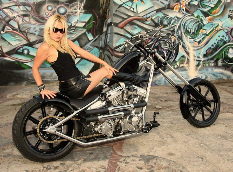 Woman on custom chopper motorcycle