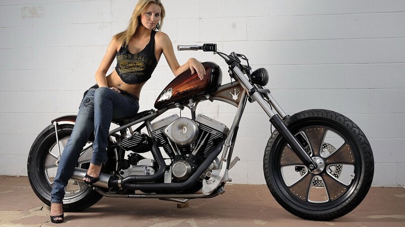 Woman on custom chopper motorcycle