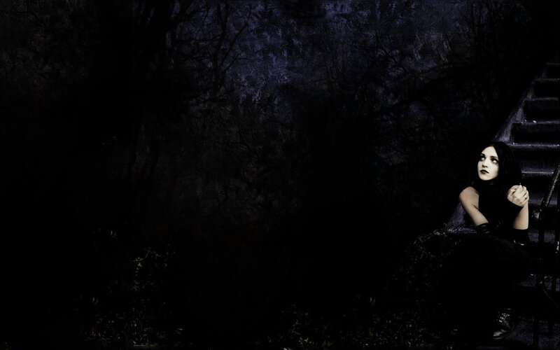 woman on dark stairs