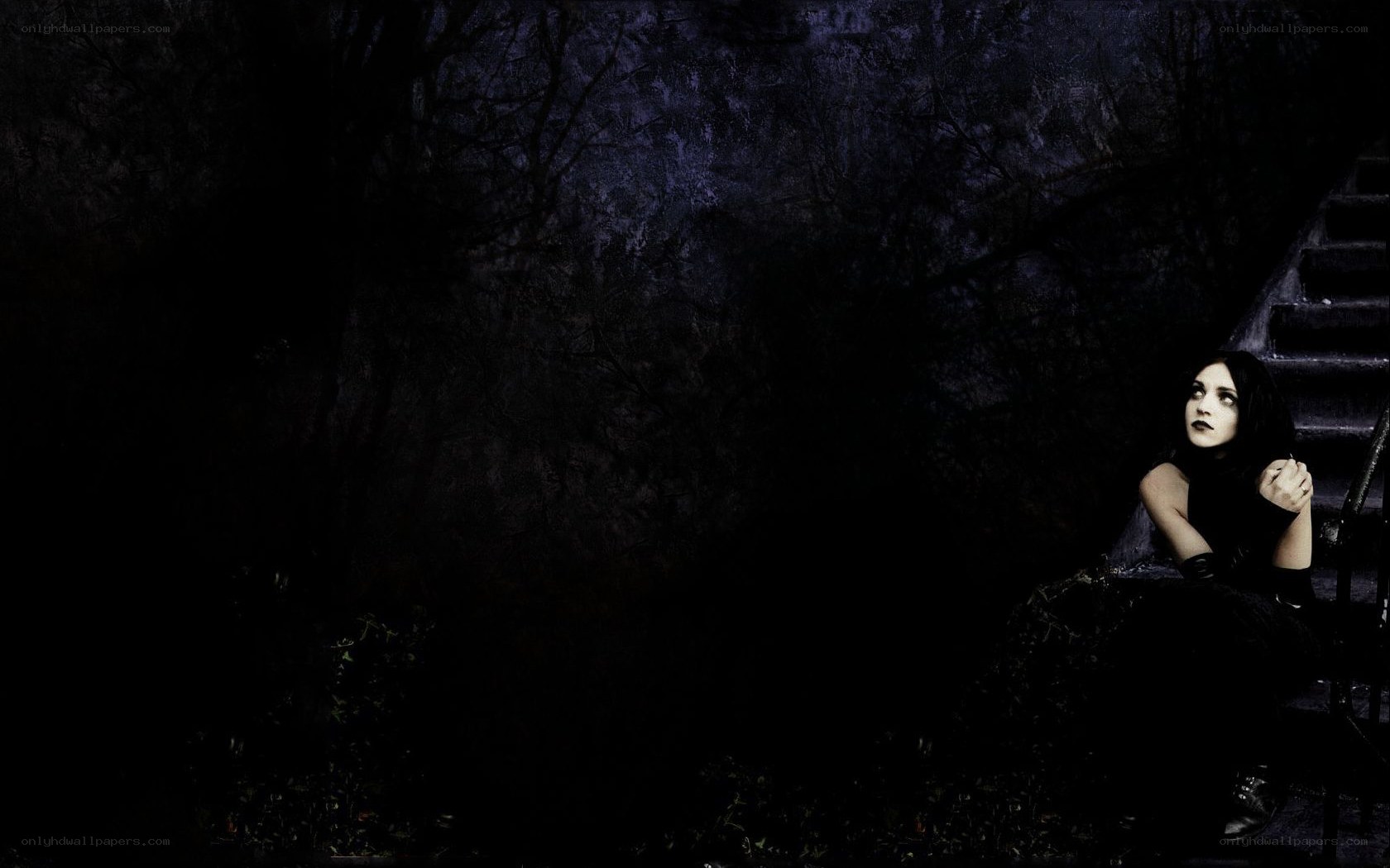 woman on dark stairs
