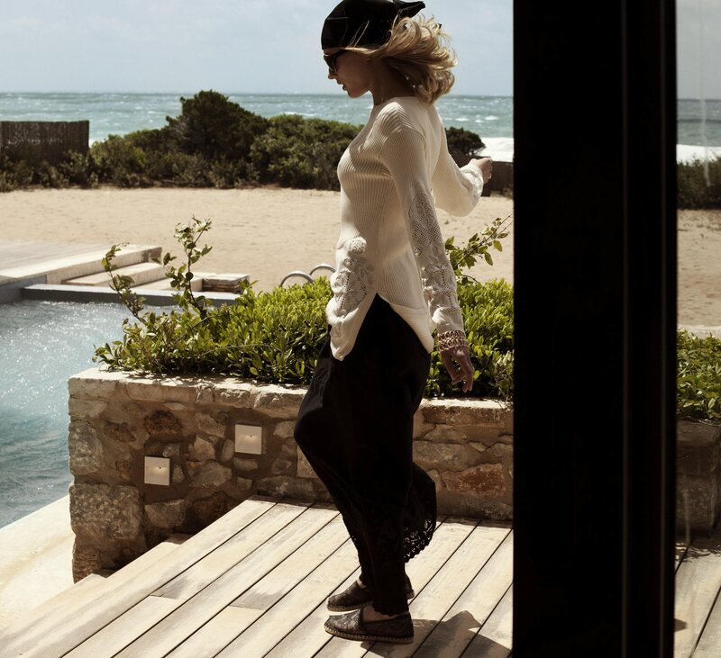 Woman on deck near beach