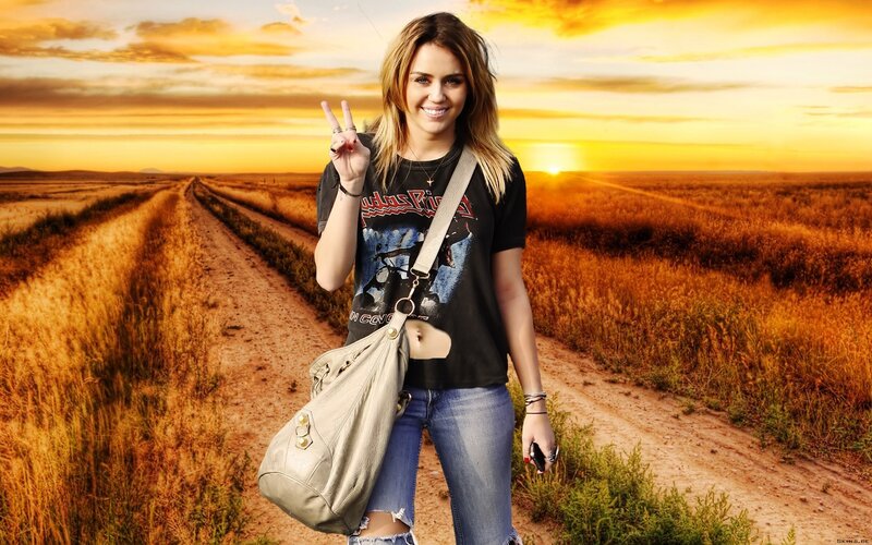 woman on dirt road at sunset