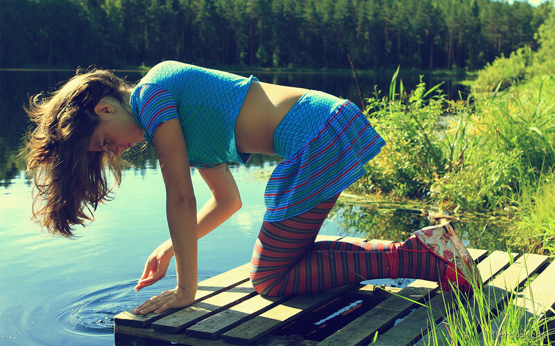 woman on dock by lake
