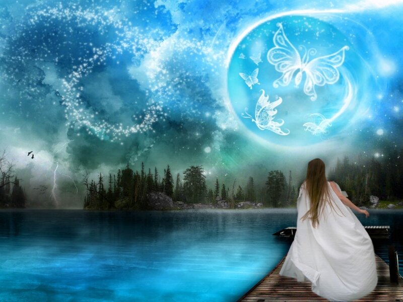 Woman on dock under magical sky