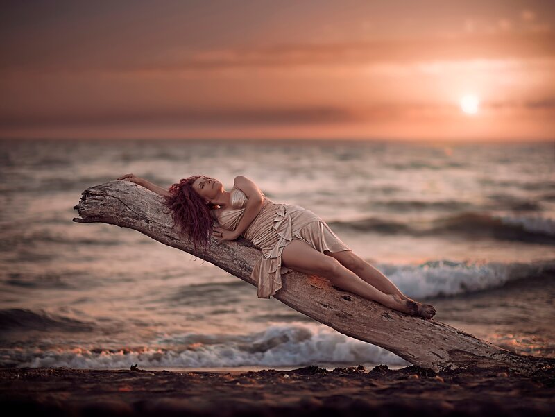 Woman on Driftwood — Orange