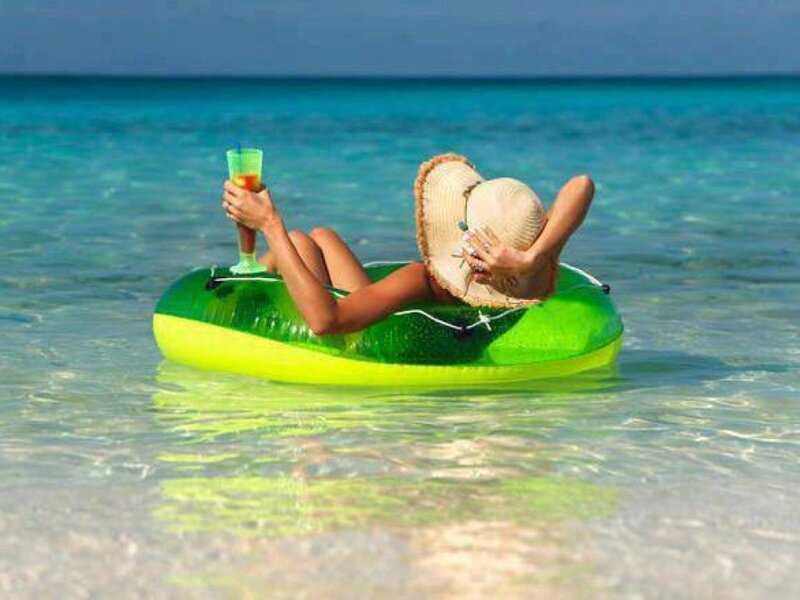 Woman on Float in Ocean