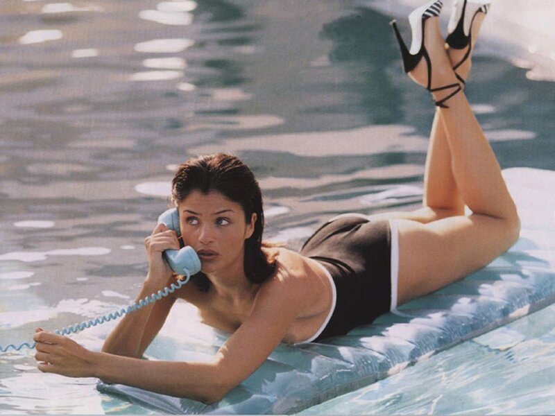 woman on float with phone