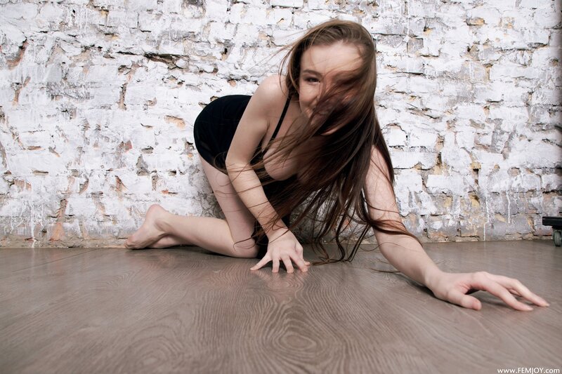 woman on floor in black outfit
