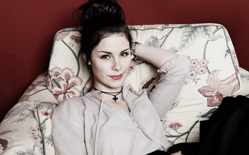 woman on floral couch