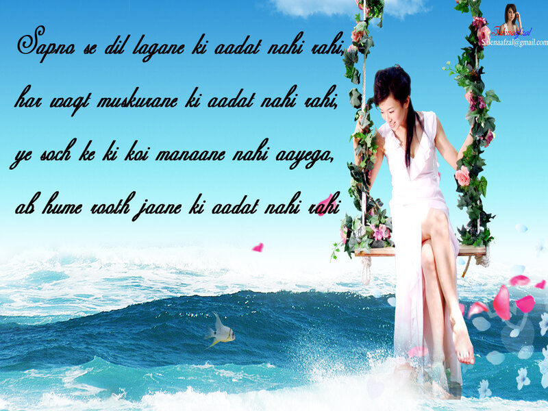 woman on floral swing by ocean
