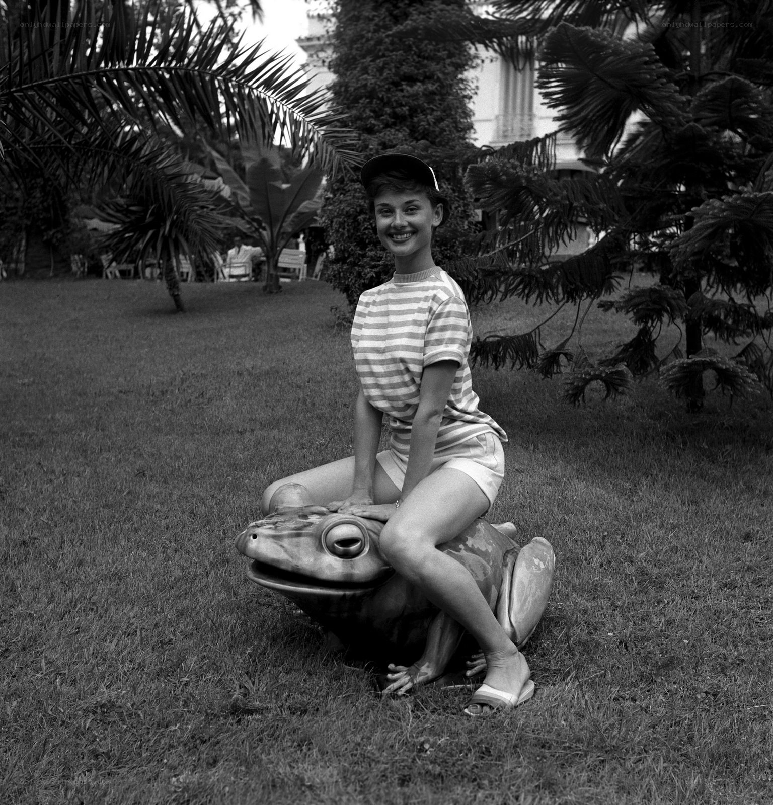 Woman on frog statue