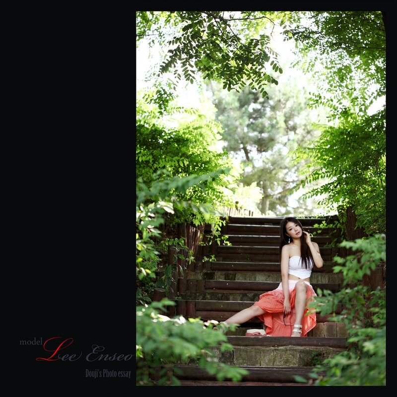 Woman on garden stairs