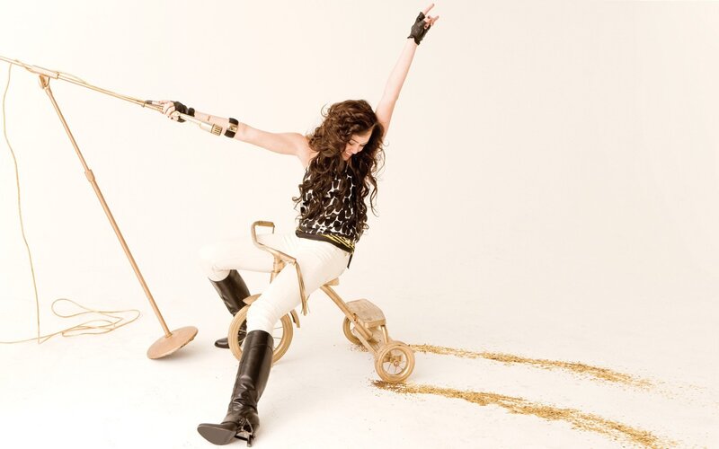 woman on golden tricycle