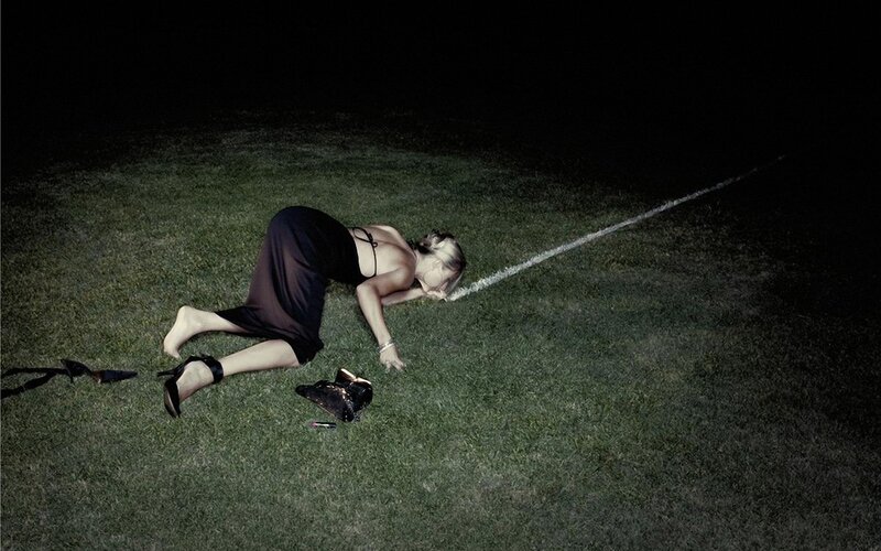Woman on grass at night