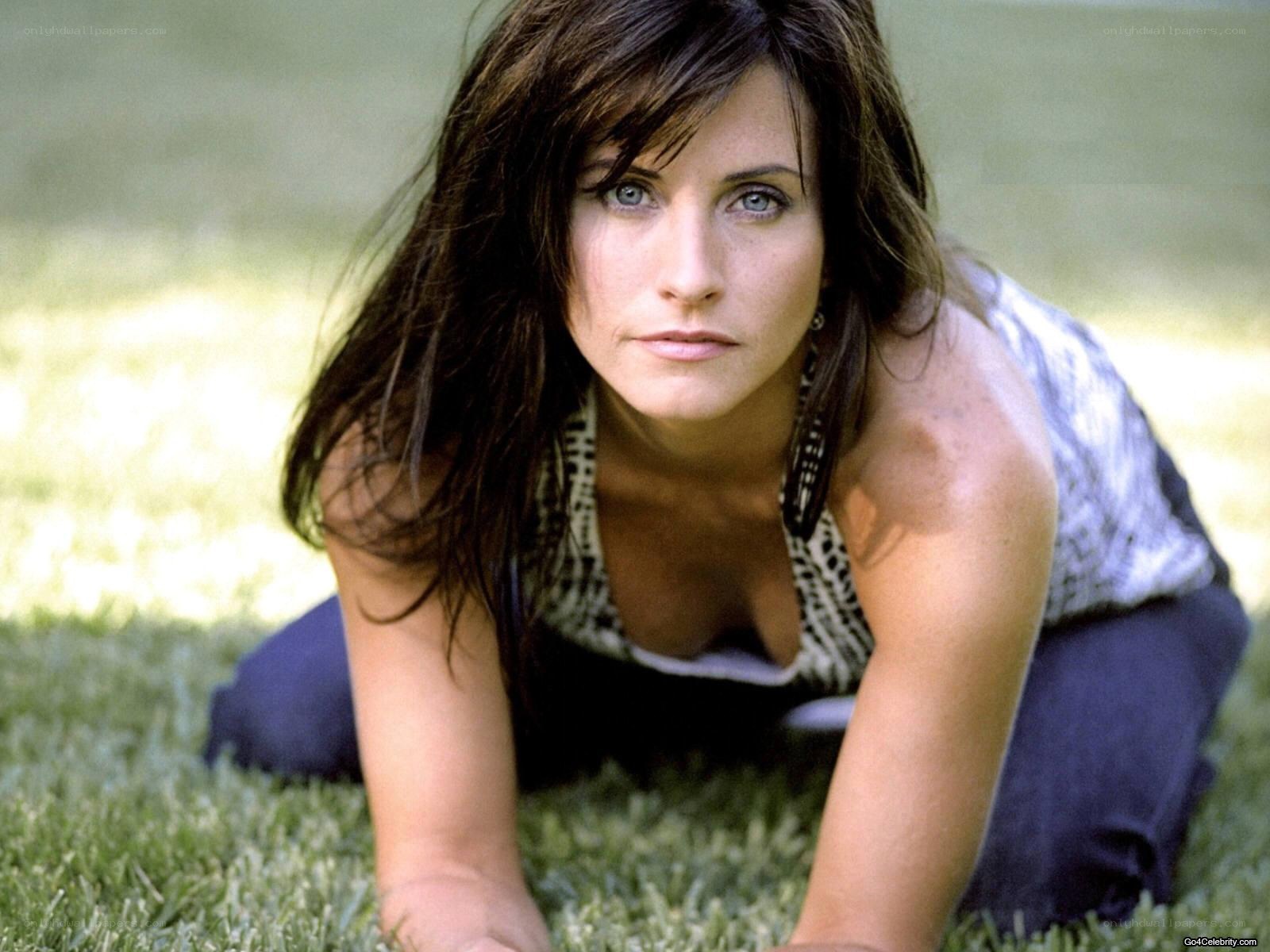 woman on grass looking at camera