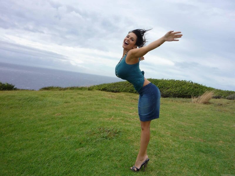 Woman on grassy cliff