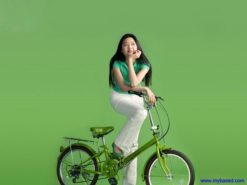 Woman on Green Bicycle