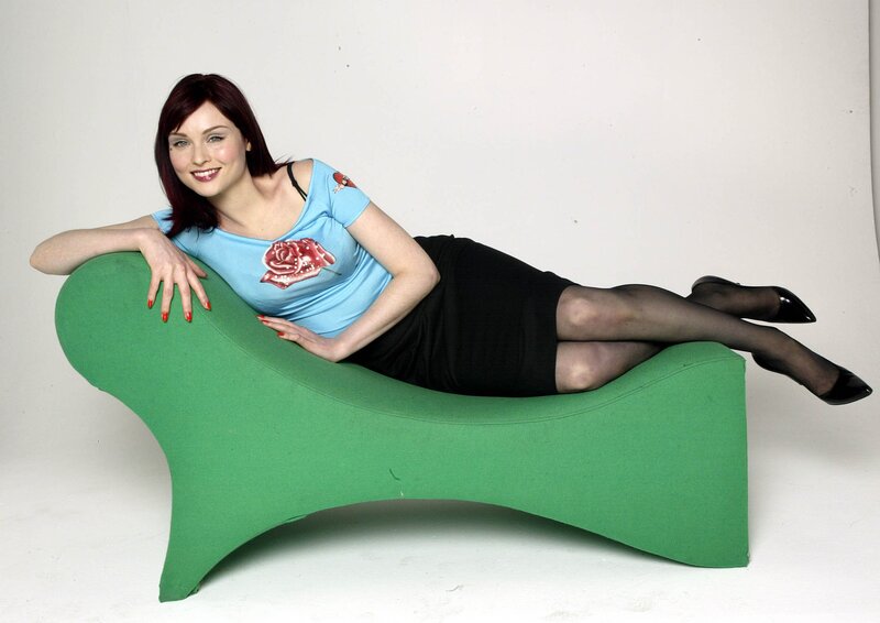 Woman on green chaise lounge