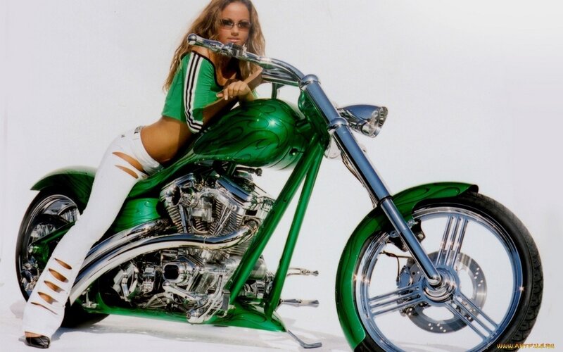 Woman on green chopper motorcycle